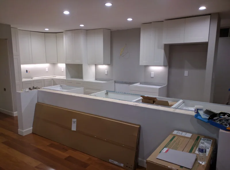 IKEA kitchen in North Bethesda MD with installation by District Handyman - large central island and knee wall with under cabinet lights