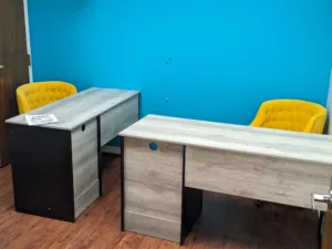 Bright yellow office chairs and modern design office desks assembled